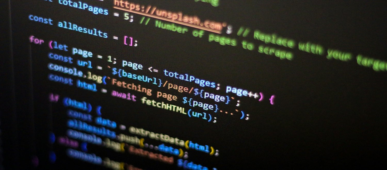 Code on a dark monitor