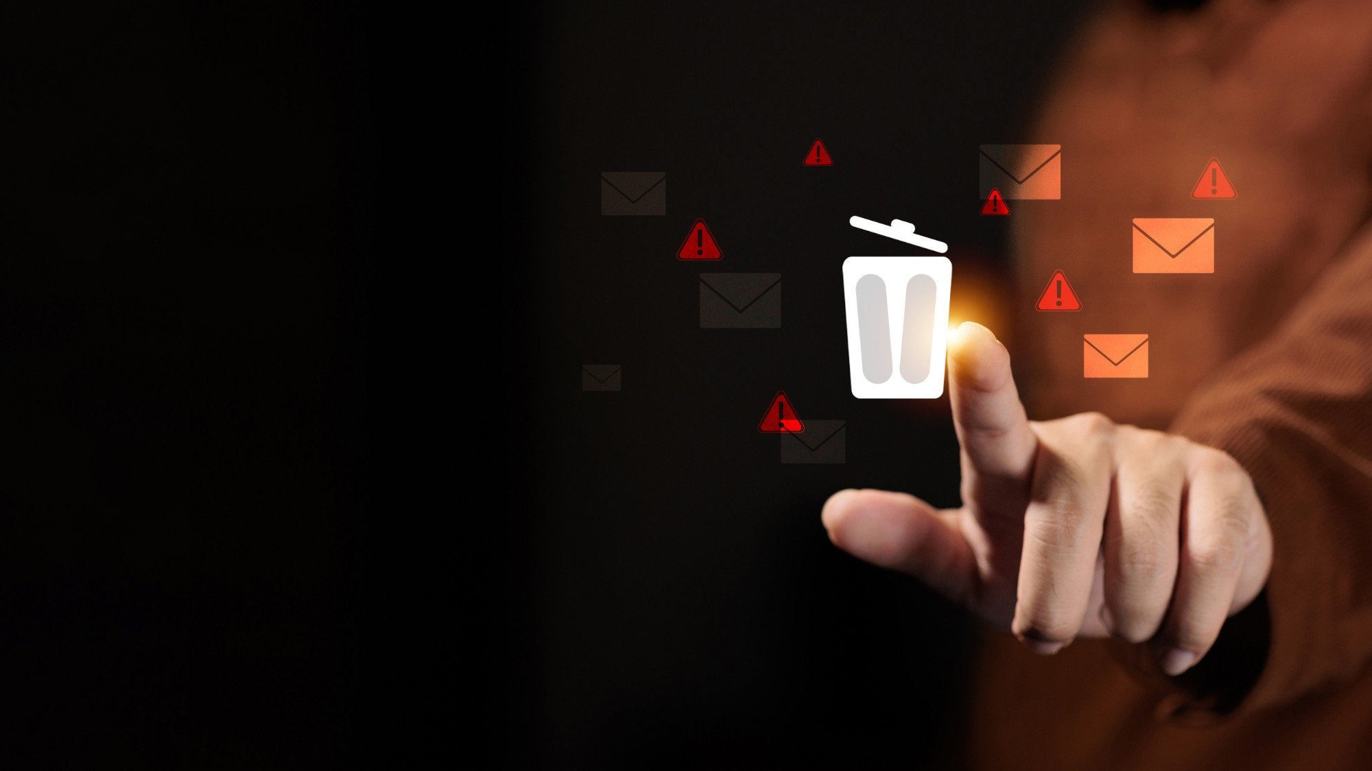 A finger tapping a glowing trash can icon, with orange envelopes and red warning signs floating around it on a dark background.