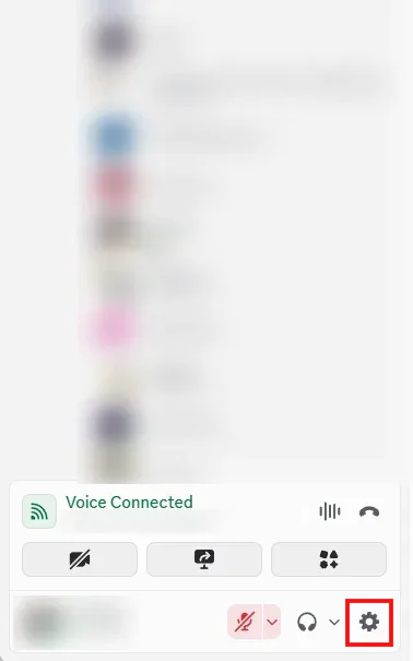 The bottom left of the Discord desktop app with the direct messages, name and avatar blurred, and the settings cogwheel boxed in red