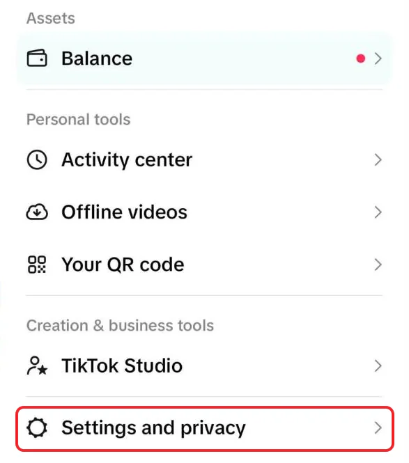 TikTok's iPhone side menu with Balance, Activity center, Offline videos, Your QR code and TikTok Studio, and Settings and privacy boxed in red at the bottom