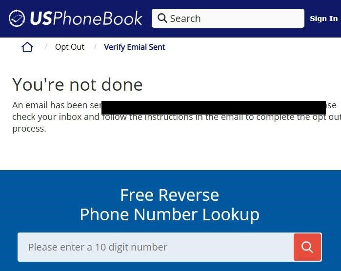USPhoneBook intermediate page with breadcrumb 'Opt Out / Verify Email Sent', a large 'You're not done' heading, and the message 'An email has been sent to [name] - [email]. Please check your inbox and follow the instructions in the email to complete the opt out process.' Below the message sits a blue 'Free Reverse Phone Number Lookup' widget with a phone-number search field and a magnifying-glass button - the broker's attempt to keep the user engaged on-site instead of completing the opt-out.